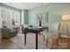 Well-lit home office features a desk, comfortable seating, and stylish decor at 1033 Ridge Haven Rd, Waxhaw, NC 28173