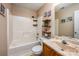Bathroom with white shower/tub combination and wood vanity at 108 Vermillion Loop, Statesville, NC 28625