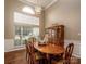 Open dining room featuring large windows and space for entertaining at 108 Vermillion Loop, Statesville, NC 28625