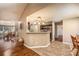 Open concept kitchen and dining area with dark cabinets and stainless steel appliances at 108 Vermillion Loop, Statesville, NC 28625