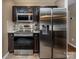 Kitchen with stainless steel appliances, microwave, oven, and refrigerator at 108 Vermillion Loop, Statesville, NC 28625