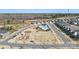 Wide aerial shot of the community featuring a pool, playground, green space, and residential homes at 11518 Solstice Way, Huntersville, NC 28078