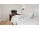 This bedroom features a television on a dark wood dresser, with white walls and neutral carpet at 11518 Solstice Way, Huntersville, NC 28078