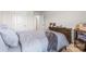 This bedroom features neutral-colored walls, neutral carpet and a dresser with various items displayed on top at 11518 Solstice Way, Huntersville, NC 28078