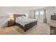 Serene bedroom with neutral tones, side tables, and bright windows at 11518 Solstice Way, Huntersville, NC 28078