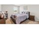 Comfortable bedroom with a large bed, neutral walls, and a window dressed with horizontal blinds at 11518 Solstice Way, Huntersville, NC 28078