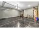 Spacious garage with sealed flooring and ample storage potential, providing a functional and organized space at 11518 Solstice Way, Huntersville, NC 28078