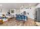 Stylish kitchen features a spacious island with bar seating, stainless steel appliances, and modern white cabinetry at 11518 Solstice Way, Huntersville, NC 28078