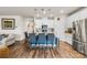 Stylish kitchen features a spacious island with bar seating, stainless steel appliances, and modern white cabinetry at 11518 Solstice Way, Huntersville, NC 28078