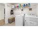 Convenient laundry room with appliances, shelving, and storage baskets at 11518 Solstice Way, Huntersville, NC 28078