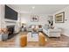 Cozy living room with fireplace, plush seating, and modern decor, perfect for relaxation and entertaining guests at 11518 Solstice Way, Huntersville, NC 28078