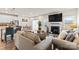 Open-concept living room with fireplace, and an abundance of natural light creating a relaxing atmosphere at 11518 Solstice Way, Huntersville, NC 28078