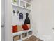 Functional mudroom with built-in storage, seating, and hooks, providing organization and convenience at 11518 Solstice Way, Huntersville, NC 28078