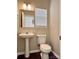Cozy bathroom featuring a pedestal sink, toilet, and a tub with a shower at 12044 Brownestone View Dr, Charlotte, NC 28269