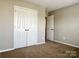Neutral bedroom featuring carpeted floors and a large closet at 12044 Brownestone View Dr, Charlotte, NC 28269