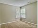 Cozy carpeted bedroom with two windows at 12044 Brownestone View Dr, Charlotte, NC 28269