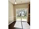 Bright breakfast nook with sliding glass door access to a fenced backyard and a detached shed at 12044 Brownestone View Dr, Charlotte, NC 28269