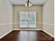 Dining room featuring dark wood floors and a chandelier at 12044 Brownestone View Dr, Charlotte, NC 28269