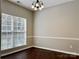 Dining room featuring dark wood floors and a chandelier at 12044 Brownestone View Dr, Charlotte, NC 28269