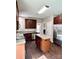 Bright kitchen with wood cabinets, stainless steel refrigerator, and island with light countertops at 12044 Brownestone View Dr, Charlotte, NC 28269