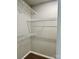 Walk-in closet with wood-look flooring and multiple tiers of wire shelving at 12044 Brownestone View Dr, Charlotte, NC 28269