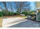Expansive backyard with ample space, featuring a patio area with a dining set and a grill at 1246 Rising Oak Dr, Charlotte, NC 28206