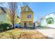 Large backyard featuring a dining table and chairs, a barbecue grill, and lush greenery at 1246 Rising Oak Dr, Charlotte, NC 28206