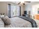 Bedroom with neutral tones, ceiling fan, and a window with curtains; bathroom is attached at 1246 Rising Oak Dr, Charlotte, NC 28206