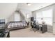 Well-lit bedroom features a daybed, desk, and large windows, creating a bright and airy space at 1246 Rising Oak Dr, Charlotte, NC 28206