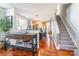 Open concept dining area with hardwood floors, leading into the kitchen and staircase at 1246 Rising Oak Dr, Charlotte, NC 28206