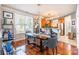 Elegant dining area with a modern chandelier and a view of the updated kitchen at 1246 Rising Oak Dr, Charlotte, NC 28206