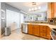 Kitchen area with stainless steel dishwasher, sink, and wooden cabinets at 1246 Rising Oak Dr, Charlotte, NC 28206