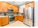 Bright kitchen with stainless steel appliances and tile backsplash at 1246 Rising Oak Dr, Charlotte, NC 28206