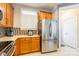 Kitchen featuring stainless steel refrigerator and wooden cabinets at 1246 Rising Oak Dr, Charlotte, NC 28206