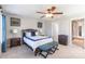Cozy bedroom with ceiling fan, warm lighting, and blue accent decor at 1246 Rising Oak Dr, Charlotte, NC 28206