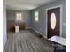 Spacious living room with neutral walls, modern woodgrain flooring, and natural light at 126 Lowry St, Chester, SC 29706