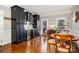 Elegant dining area featuring custom black cabinetry, a wine fridge, and stylish wooden furniture at 1263 Crooked Stick Dr, Rock Hill, SC 29730