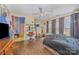 Bedroom featuring hardwood floors, a ceiling fan, and a makeup vanity at 1386 Jennings Rd, Statesville, NC 28625