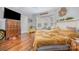 Bedroom featuring hardwood floors, multiple windows, and rustic furniture at 1386 Jennings Rd, Statesville, NC 28625