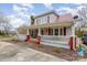 Inviting home featuring a spacious front porch with ample seating, perfect for enjoying the outdoors at 1386 Jennings Rd, Statesville, NC 28625