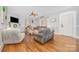 Bright living room featuring hardwood floors, a ceiling fan, a decorative fireplace and lots of natural light at 1386 Jennings Rd, Statesville, NC 28625