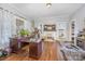Bright and versatile room with hardwood floors, perfect for use as a home office or den at 1386 Jennings Rd, Statesville, NC 28625