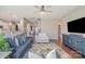 Cozy living room with stylish furnishings, ceiling fan, and hardwood floors at 15131 Oleander Dr, Charlotte, NC 28278