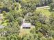Aerial view of a secluded home surrounded by mature trees and lush greenery at 1755 Simplicity Rd, Concord, NC 28025