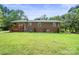 Spacious backyard with well-maintained lawn and exterior of the home with a wooden deck at 1755 Simplicity Rd, Concord, NC 28025
