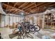 Unfinished basement space features an open ceiling, storage area, and concrete flooring at 1755 Simplicity Rd, Concord, NC 28025