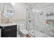 Modern bathroom featuring a glass-enclosed shower, granite vanity, tiled floors, and decorative accent tiles at 1755 Simplicity Rd, Concord, NC 28025
