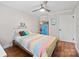 Bedroom with hardwood floors, ceiling fan, a storage, and a single bed with colorful quilt at 1755 Simplicity Rd, Concord, NC 28025