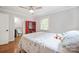 This neutral bedroom features a ceiling fan, fresh paint, hardwood floors, and a connected bathroom at 1755 Simplicity Rd, Concord, NC 28025