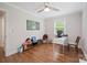 Bedroom with hardwood floors, fresh paint, a ceiling fan, a desk, and a wall-mounted bookshelf at 1755 Simplicity Rd, Concord, NC 28025